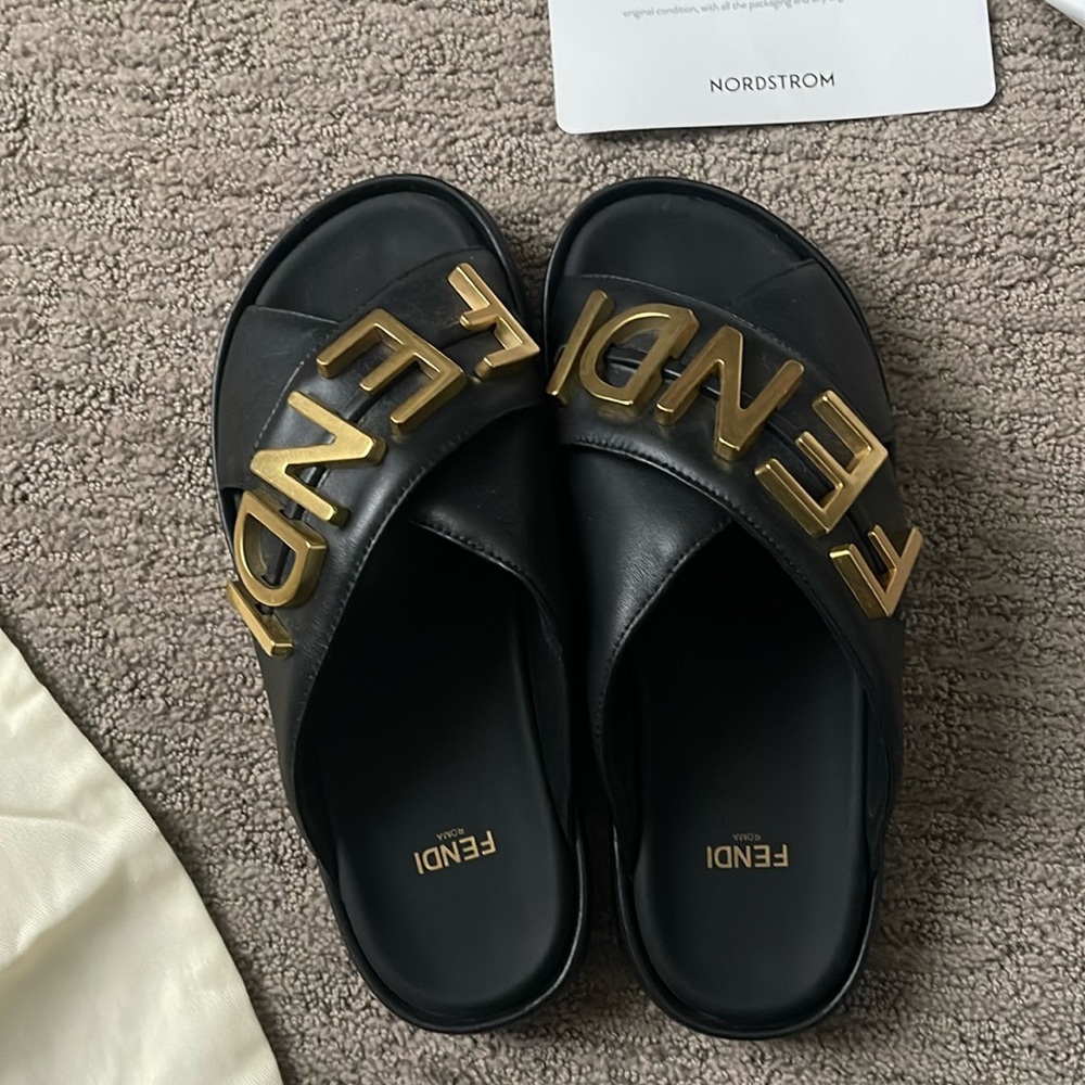 Fendi Black Slides with Bold Gold Lettering